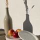 4 black speckled dessert plates on a vintage white background