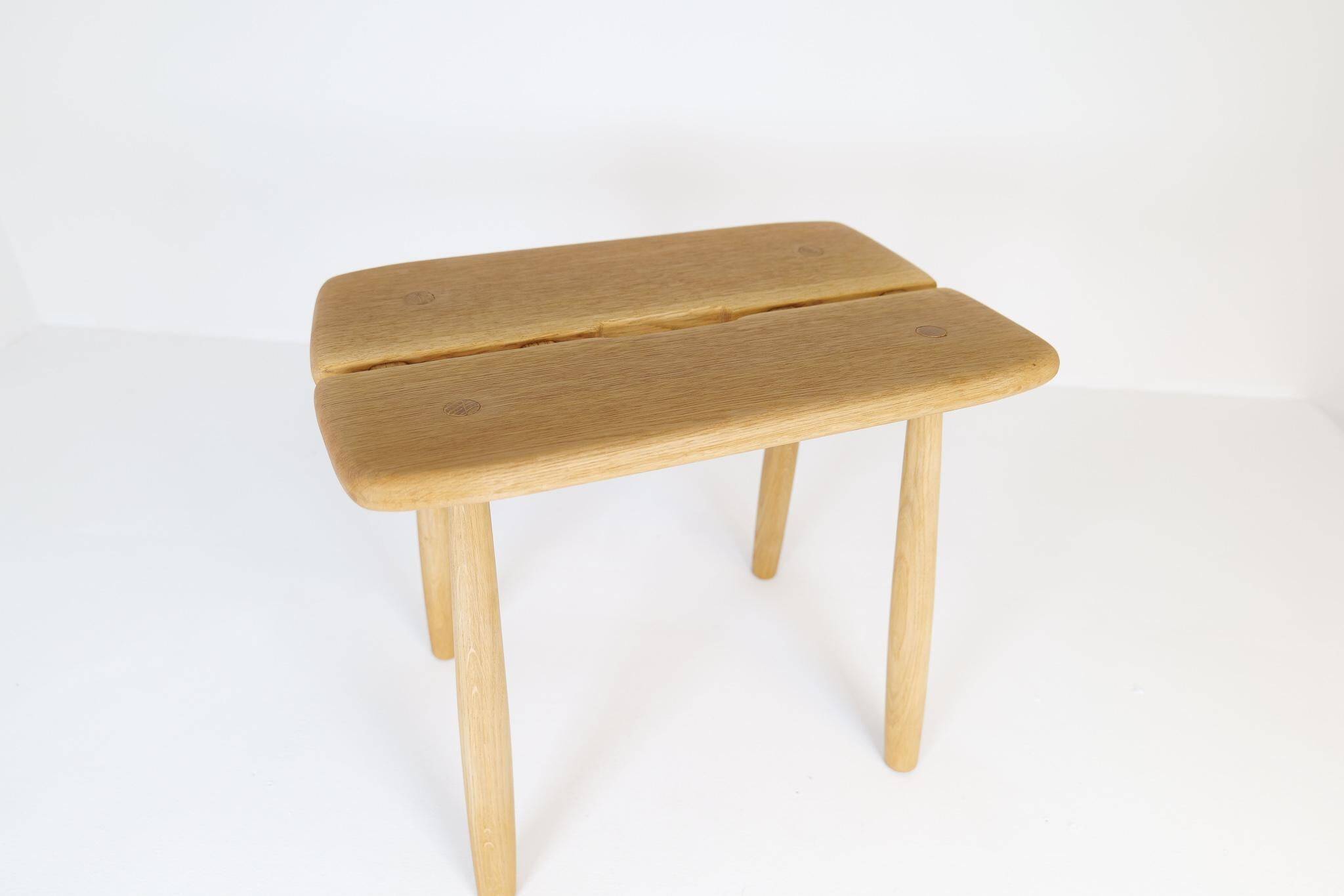 Sculptural mid-century stool in solid oak by Carl Gustaf Boulogner, Sweden, 1950s.