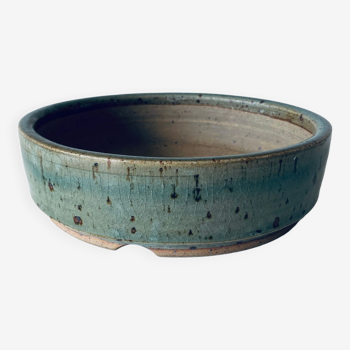 Pierced glazed stoneware cup