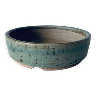 Pierced glazed stoneware cup