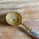 Filled and gilded silver sprinkler spoon