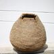 Old basket, burgundy straw and bramble, woven basket, interior decoration, pantry, flowerpot