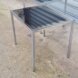 Pair of side tables in chrome metal and glass
