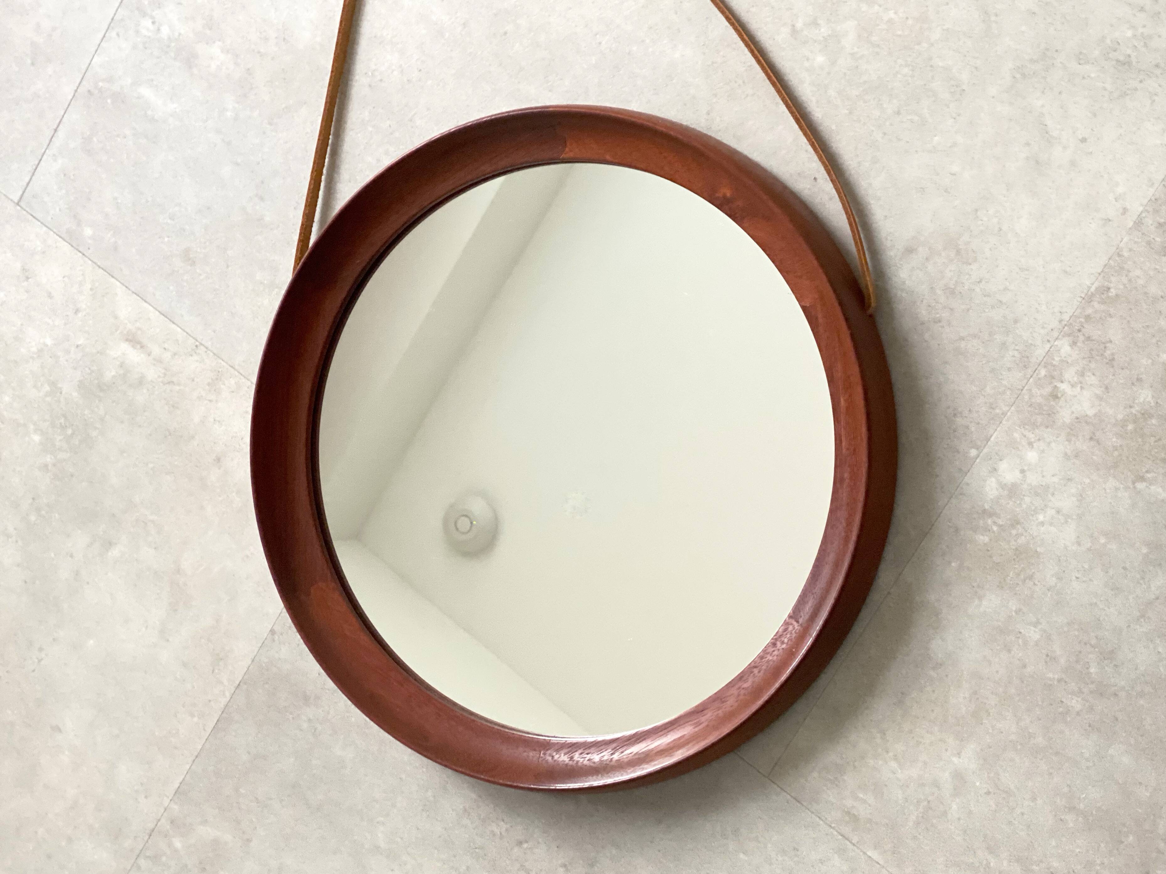 Mid Century solid teak wall mirror with a leather strap - Danish design