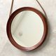 Mid Century solid teak wall mirror with a leather strap - Danish design
