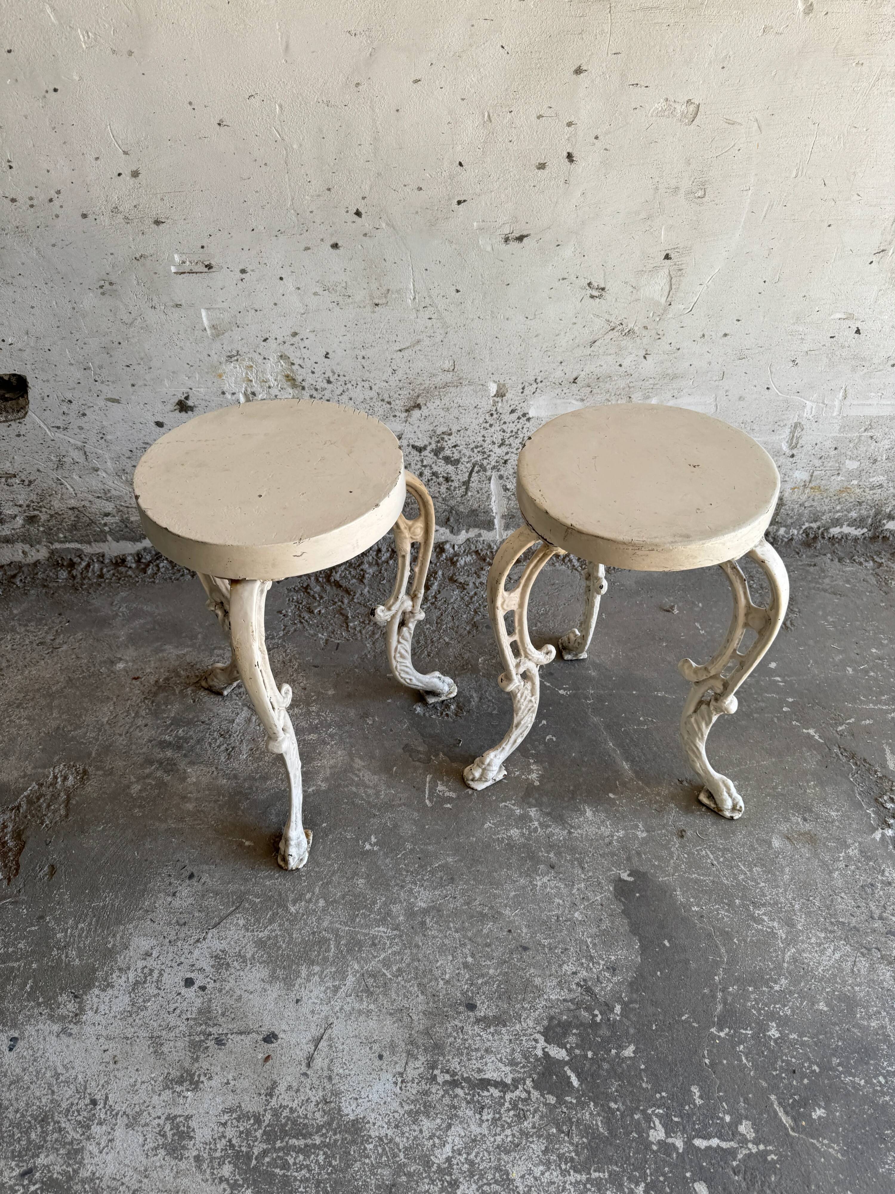 Pair of cream-white cast iron side tables with wooden tops — neoclassical shabby-chic