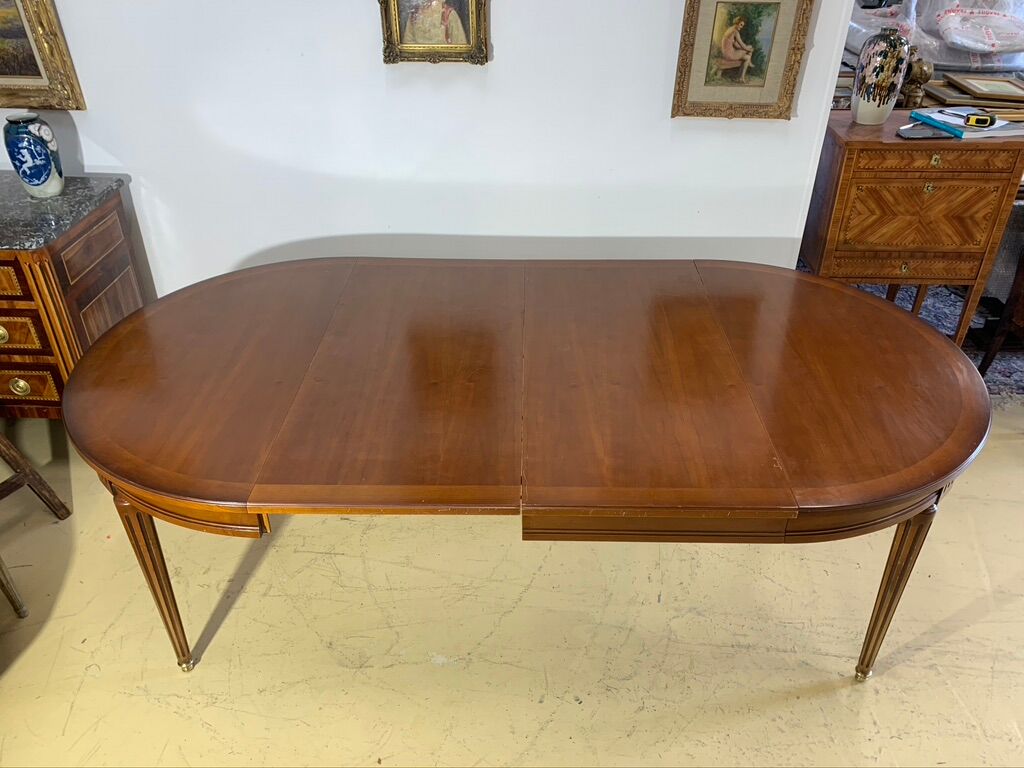 Louis XVl style round table in cherry with extensions