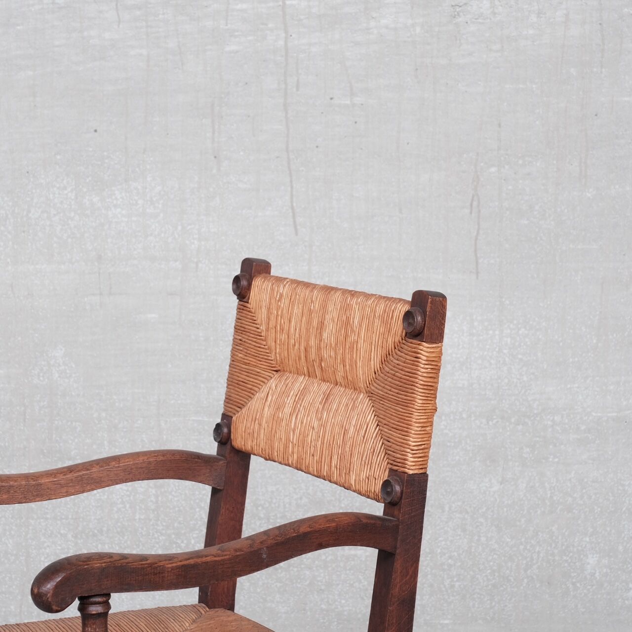 Pair of mid-century oak and rush french armchairs