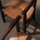Pair of solid wood and straw armchairs, France, circa 1950.