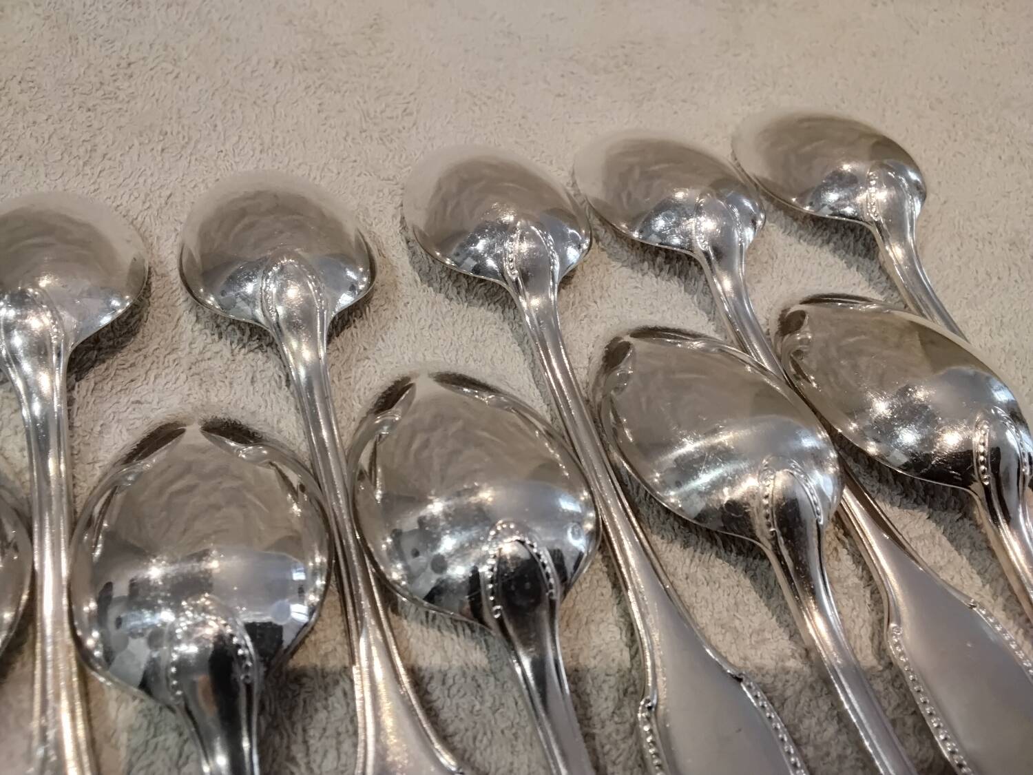 12 silver plated dessert spoons, goldsmith Alfenide, St LXVI pearls