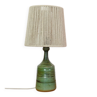 Green glazed stoneware lamp with a cord shade.