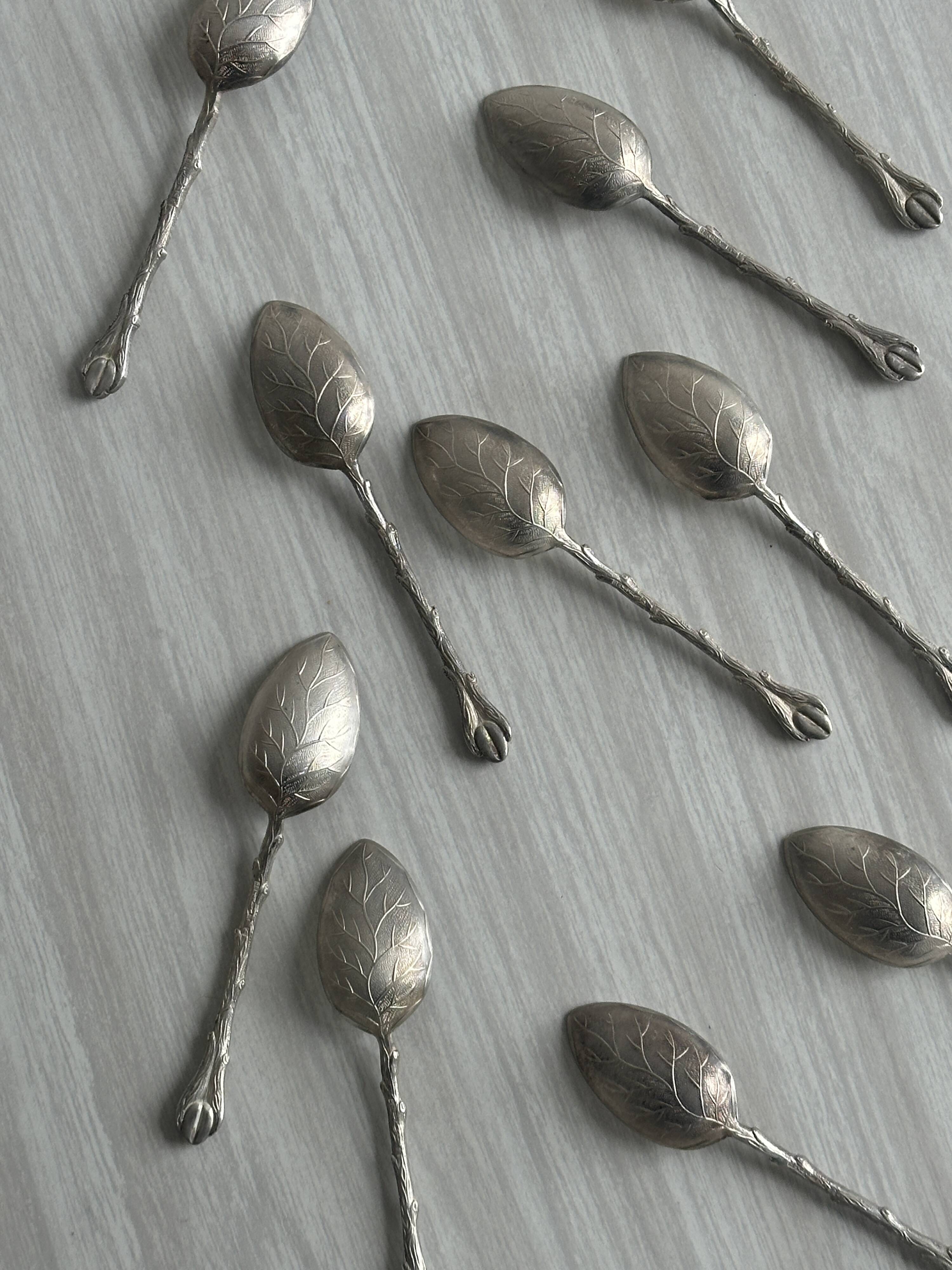 Set of 10 small silver metal spoons