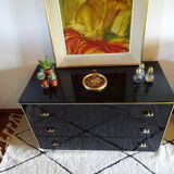 Lacquered black chest of drawers, golden brass