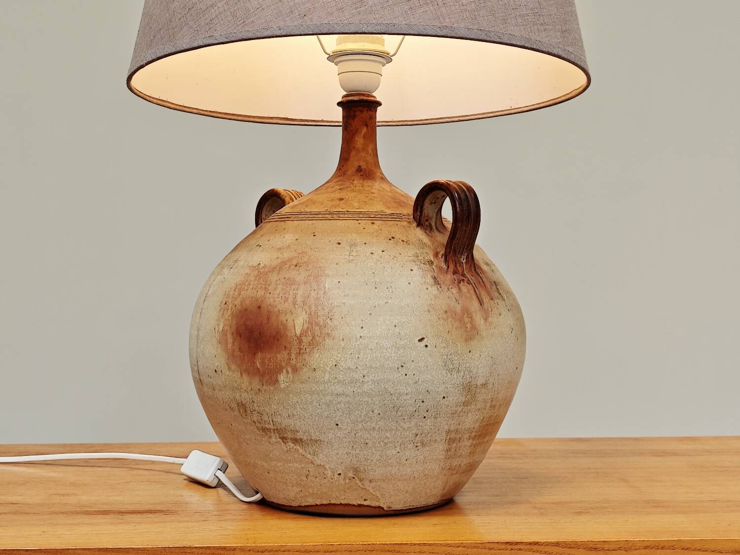Modernist ceramic sandstone lamp with two handles from the 1950s