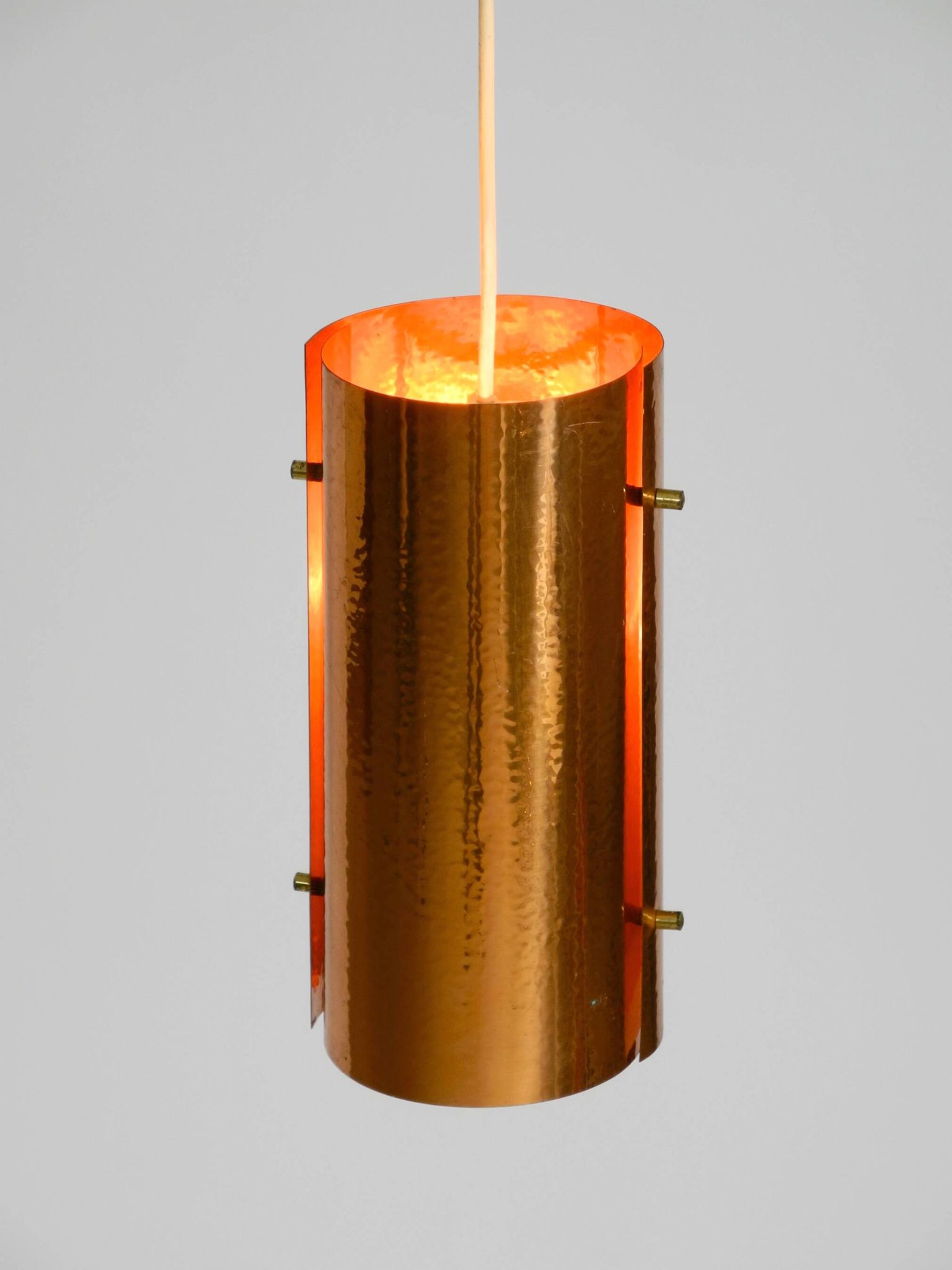 Two 50s tube pendant lamps consisting of two screwed-together copper bowls