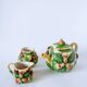 Tea service consisting of a teapot, a milk jug and a numbered hazelnut slip sugar bowl