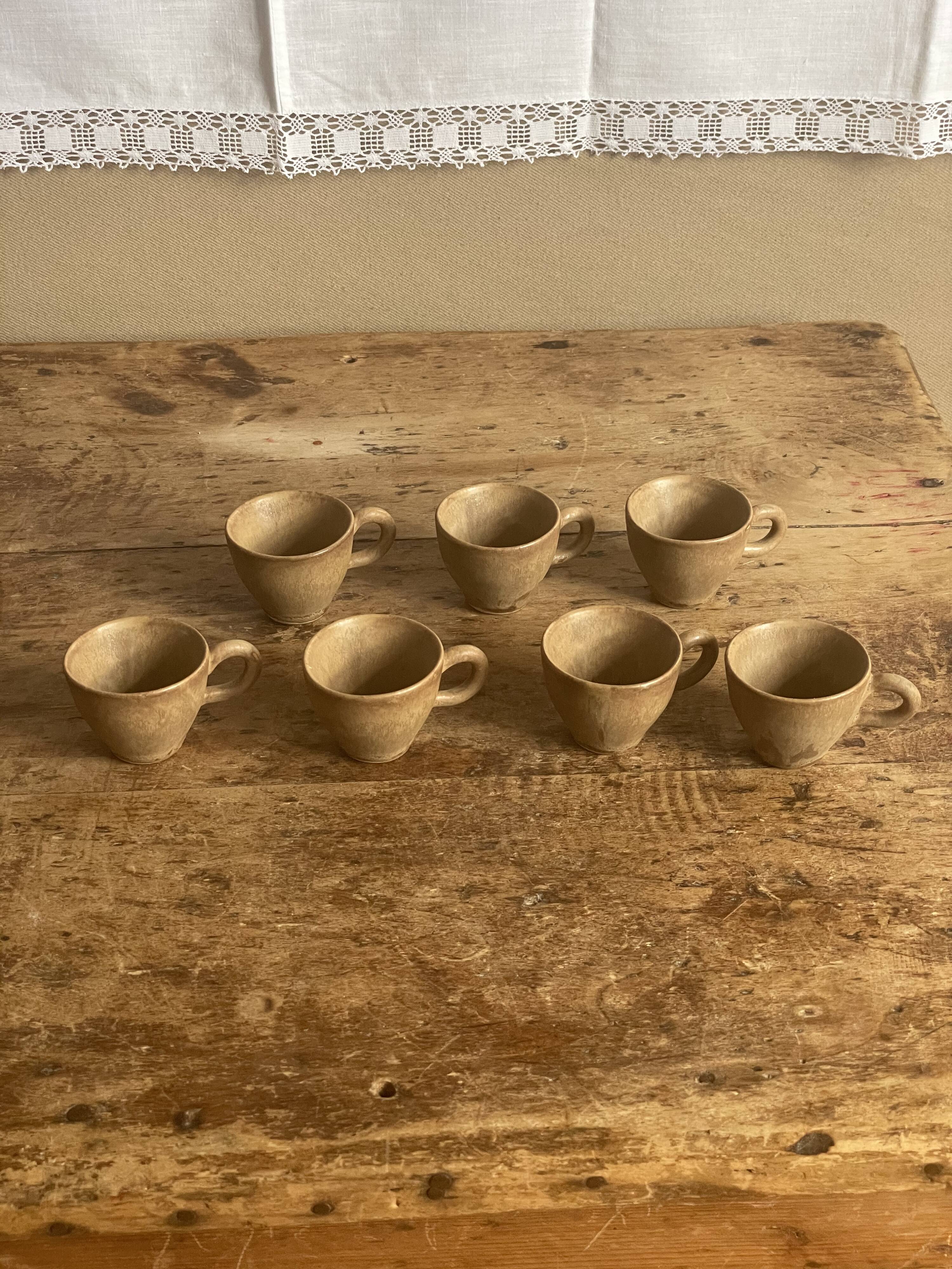 7 very small old sandstone coffee cups