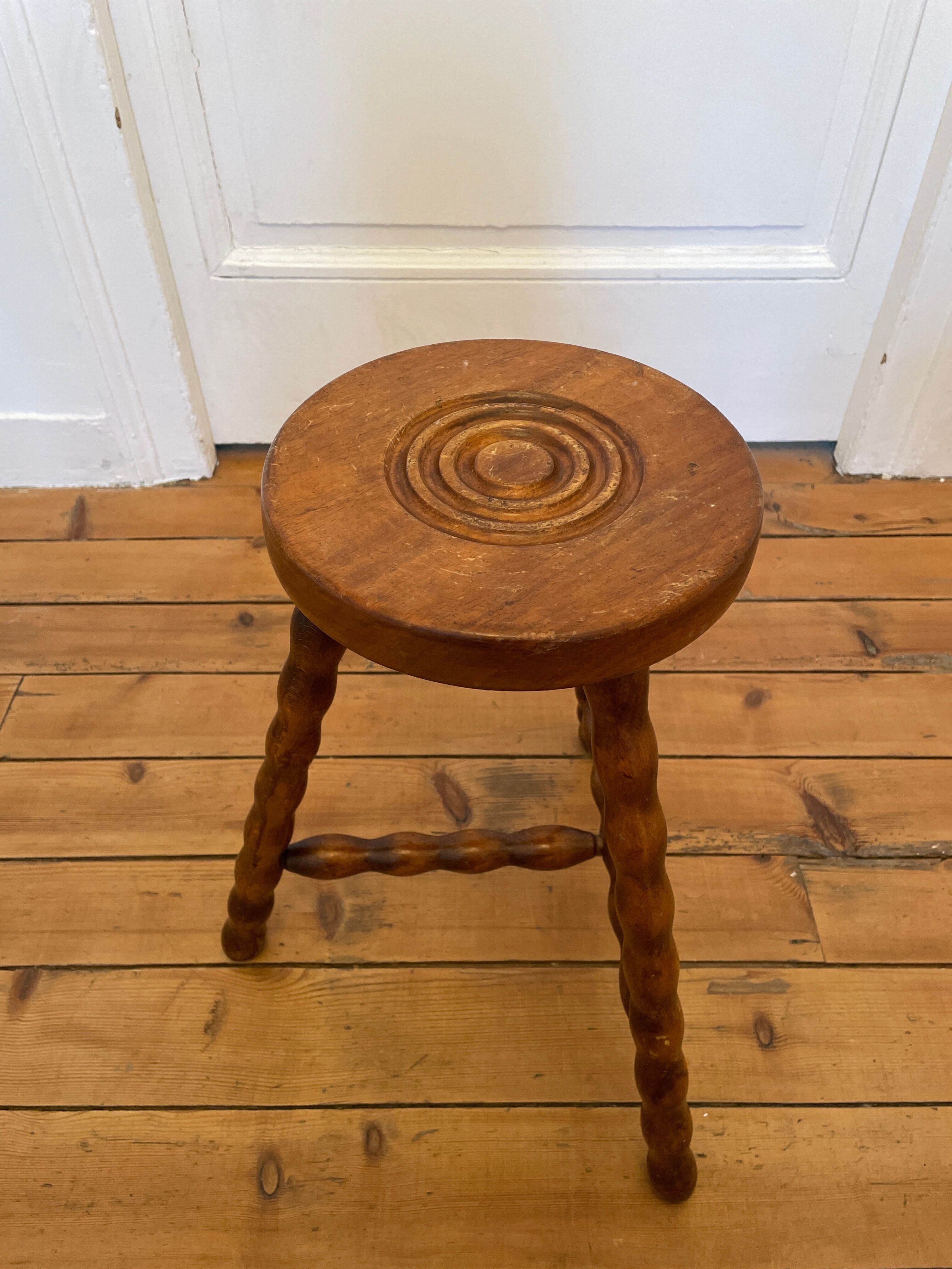 Old wooden tripod stool