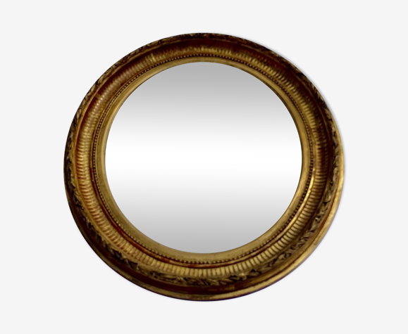 Oval wall mirror in gilded wood late nineteenth