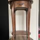 Oval bedside table from the Transition period in marquetry and bronze.