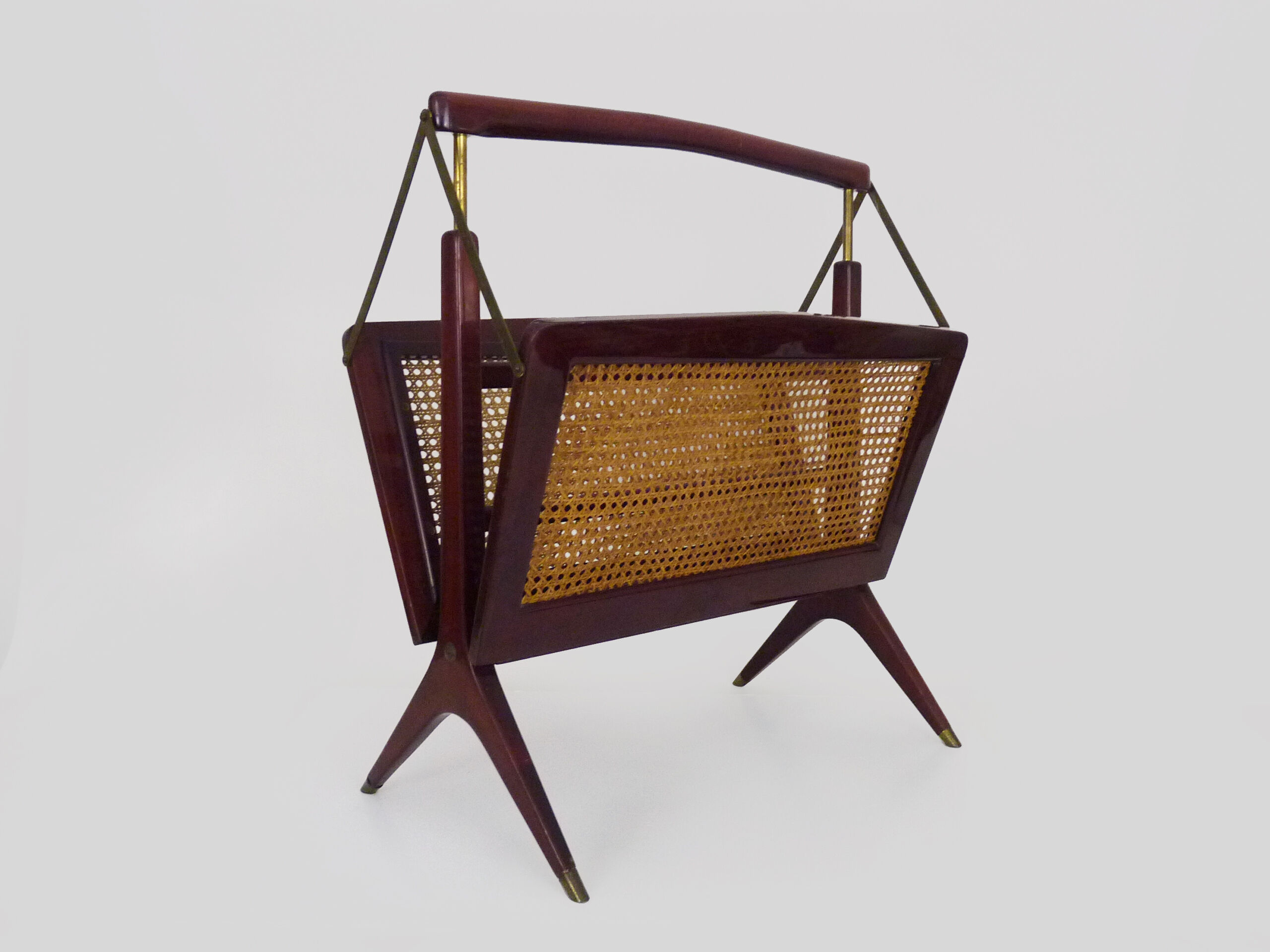 Magazine holders, italy, 1950s. walnut, canage, brass