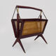 Magazine holders, italy, 1950s. walnut, canage, brass