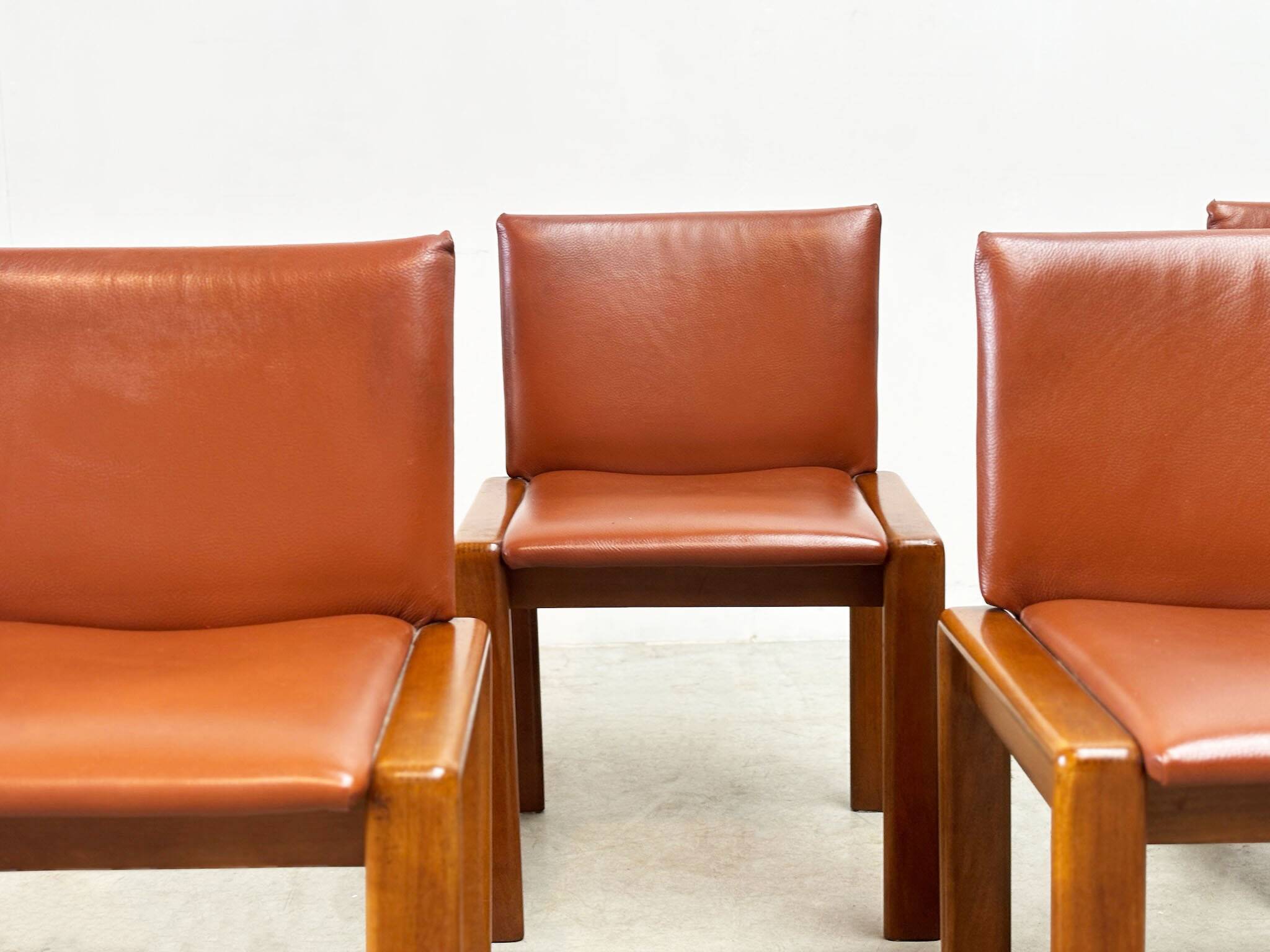 Set of six leather Italian dining chairs