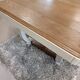 Restored oak table in natural wood and linen.