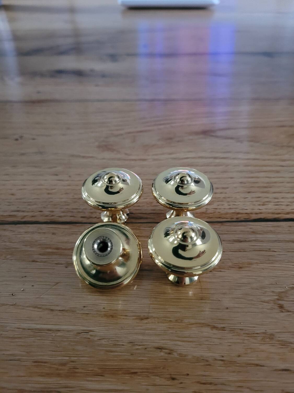 Polished brass furniture knobs