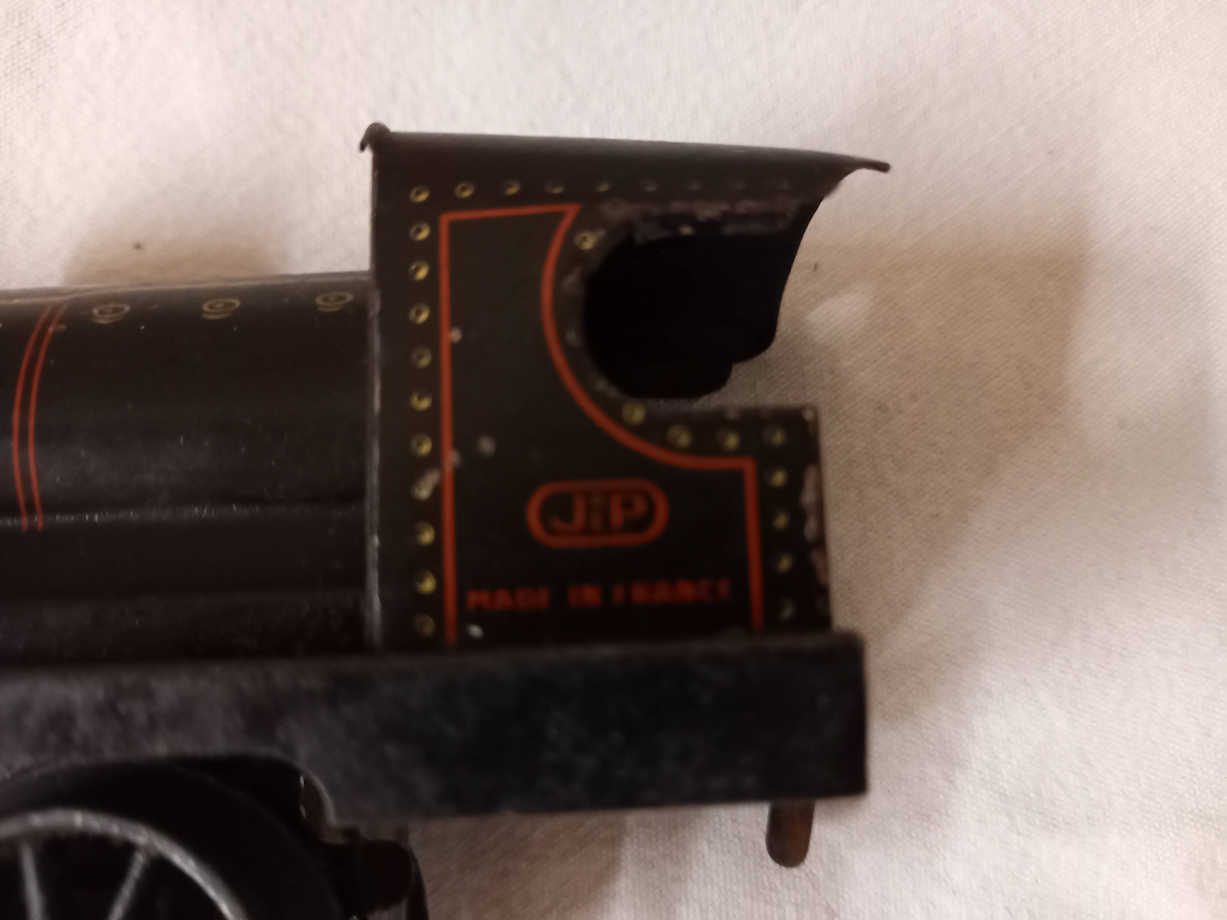 Small JEP mechanical train, including locomotive, tender, sleeping car, rail, 1930s