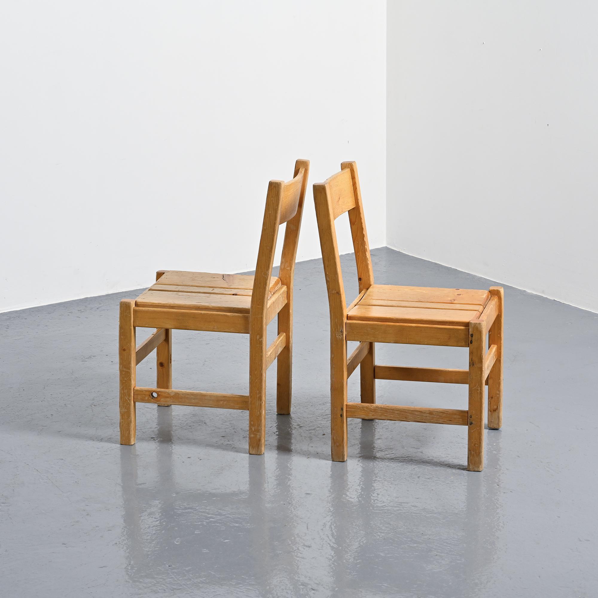 Pair of pine chairs, Maison Regain, France, circa 1970.