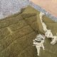 Handmade traditional pure wool rug in green, size 150 x 250 cm.