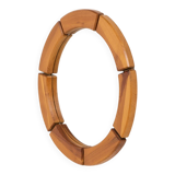 Sculptural wall mirror in solid pine