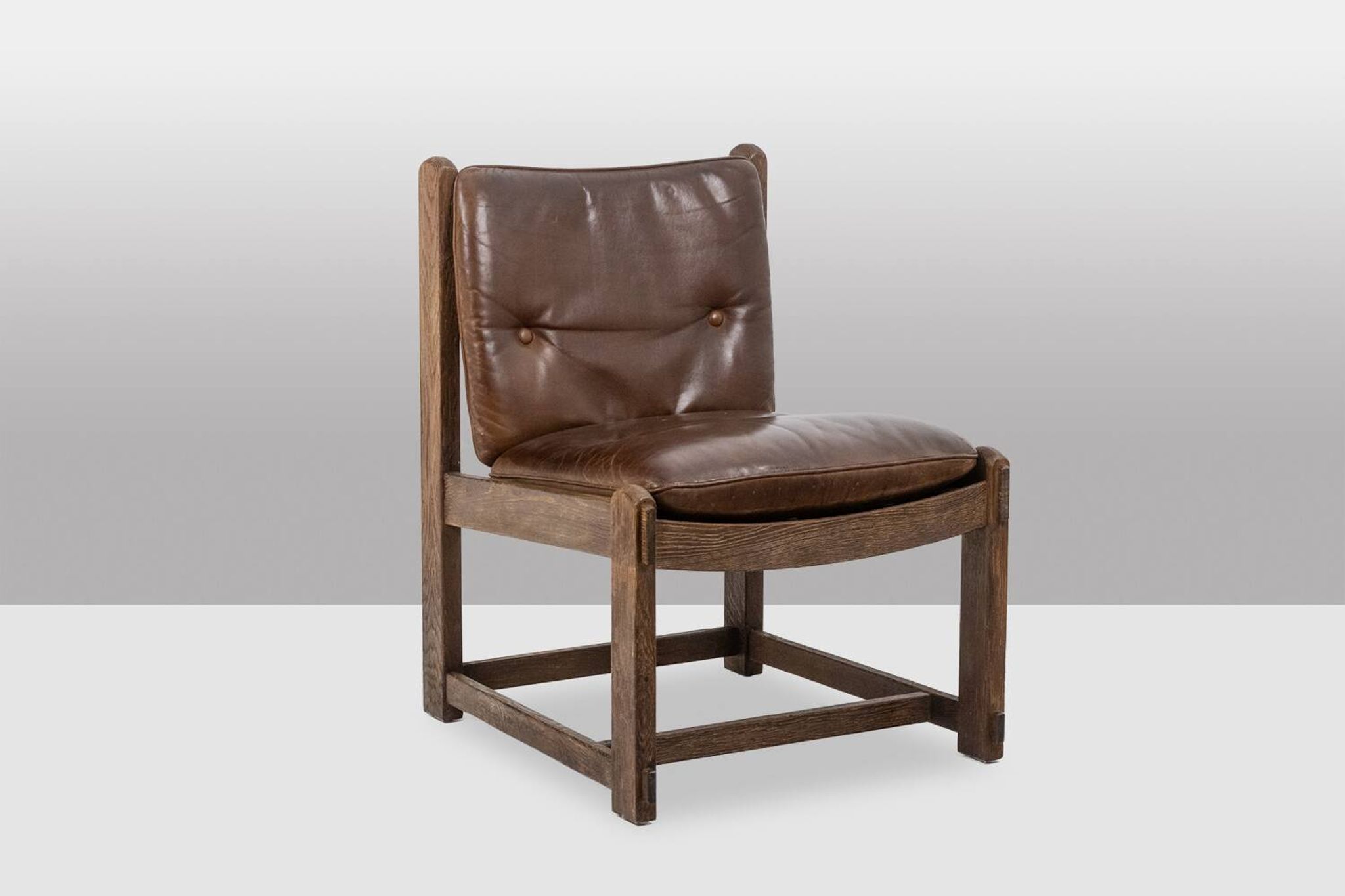 Pair of oak armchairs, upholstered in leather. Work from the 1960s.