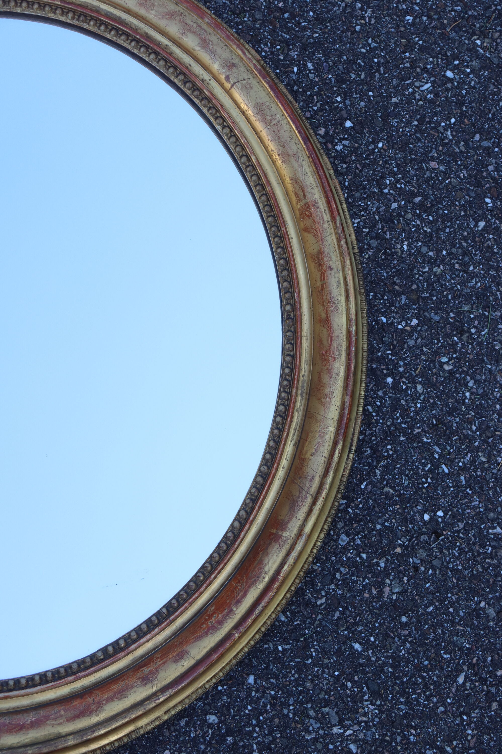 Pair of oval mirrors from the Louis Philippe period in gilded wood.