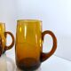 4 mugs/ mugs in vintage blown amber glass