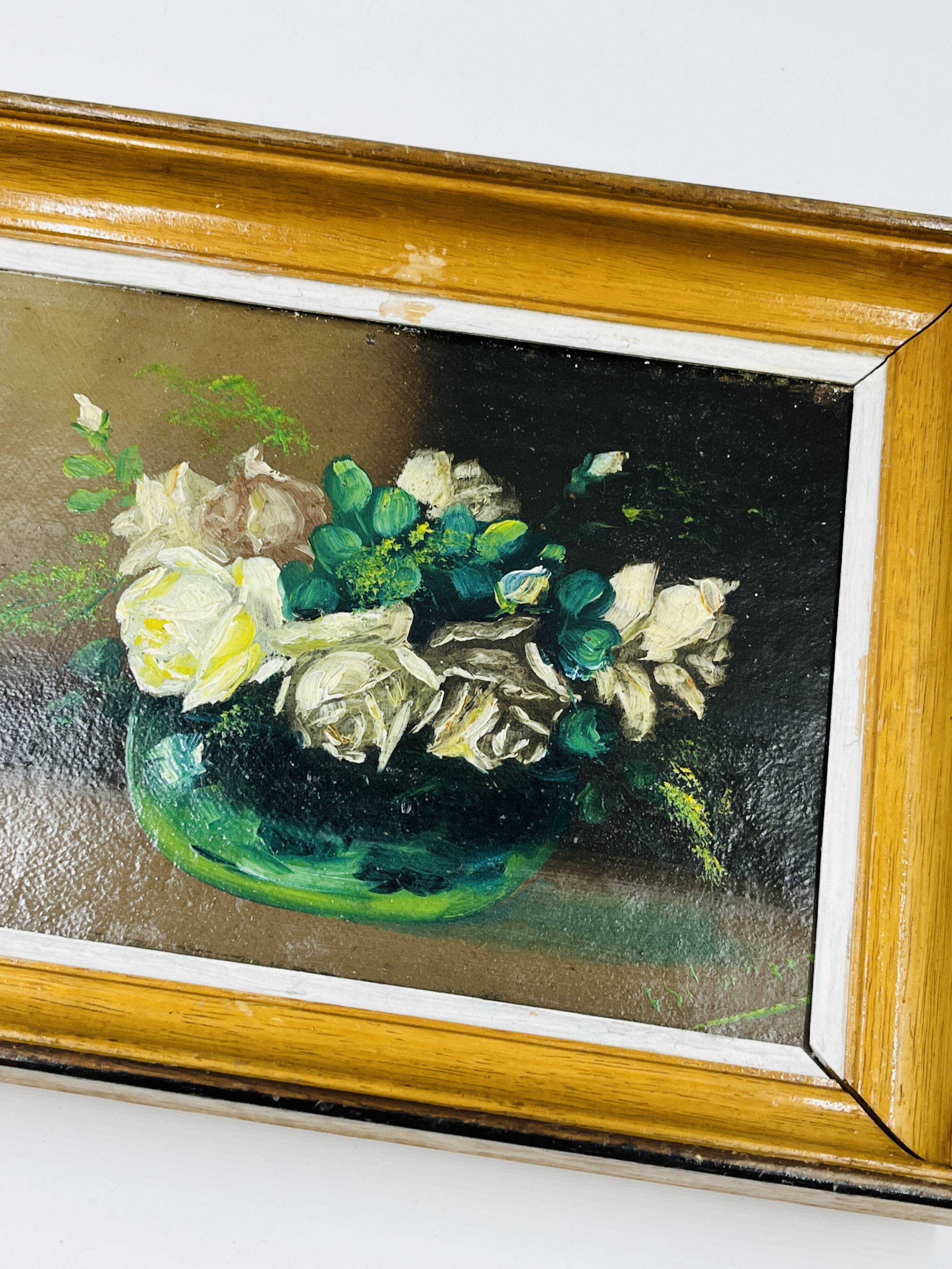 Pair of small framed vintage floral oils