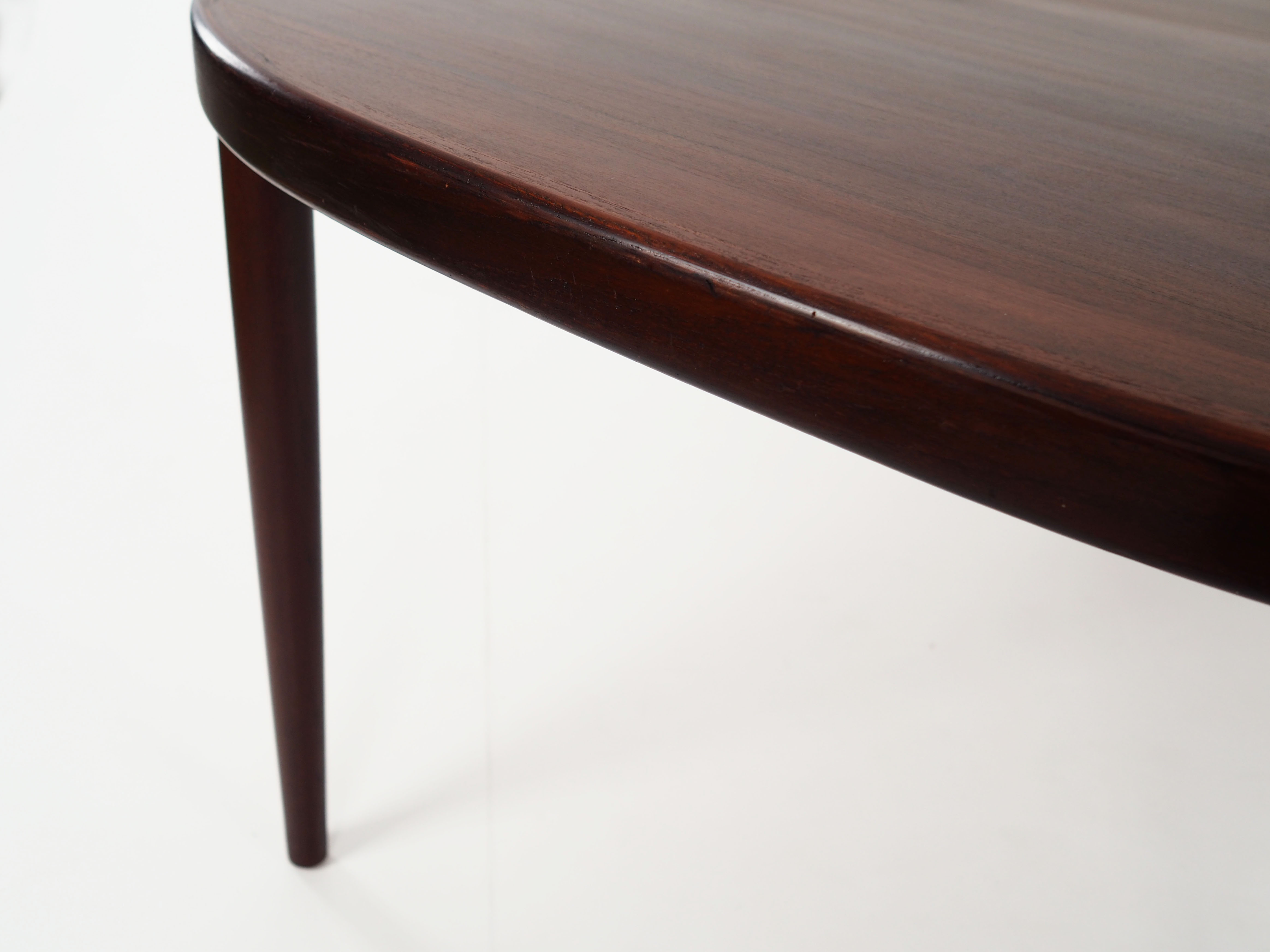 Oval table, covered with rosewood veneer.Design of the 70s