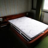 Vintage bed from the 70s with radio and built-in bedside lamp
