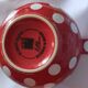 Pretty round English teapot with red polka dots.