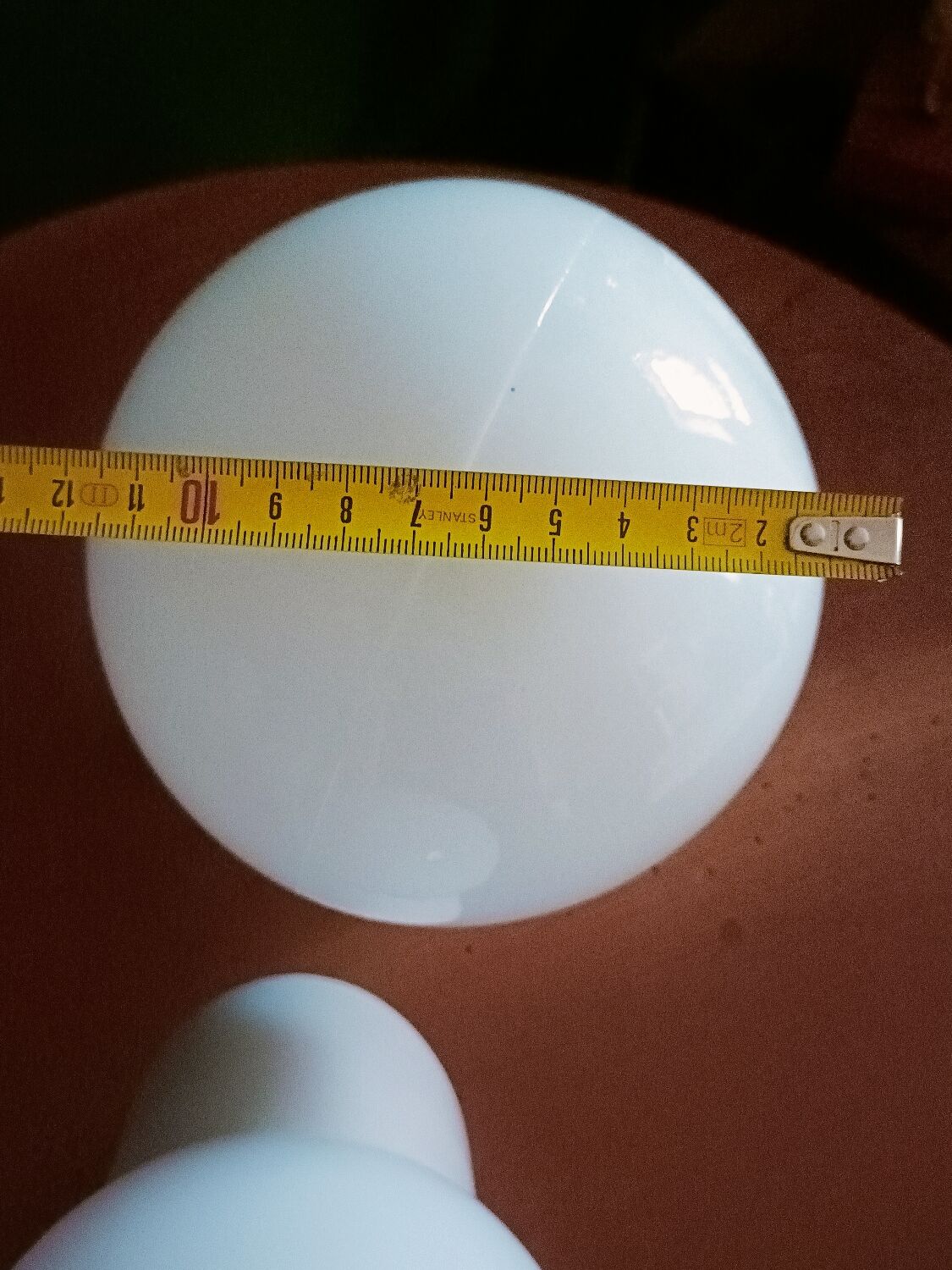 Two opaline glass globe wall lights