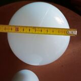 Two opaline glass globe wall lights