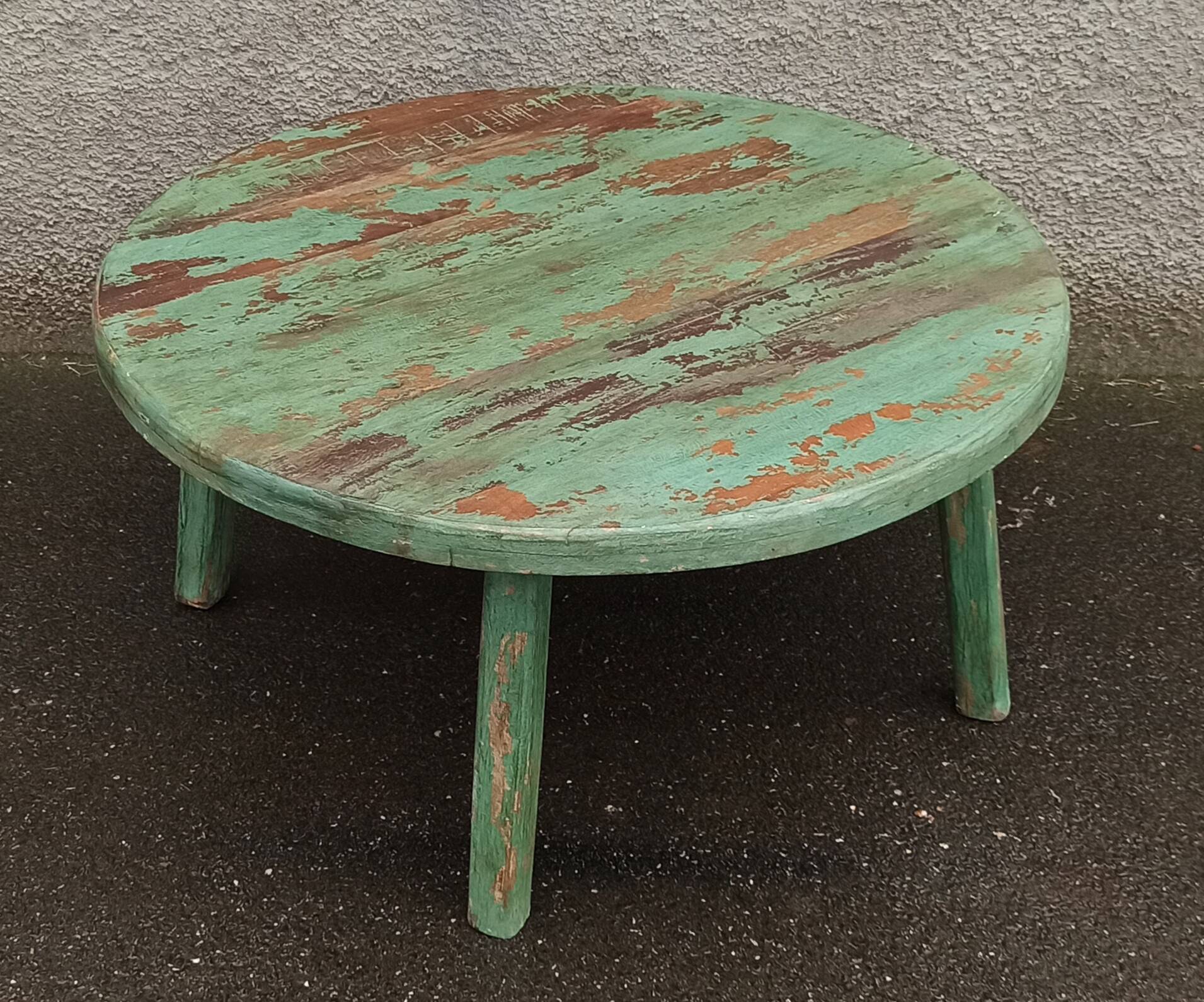 Round coffee table in old green wood
