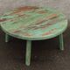 Round coffee table in old green wood