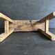 Ancient Chinese farm bench in patinated wood, small rustic stool.