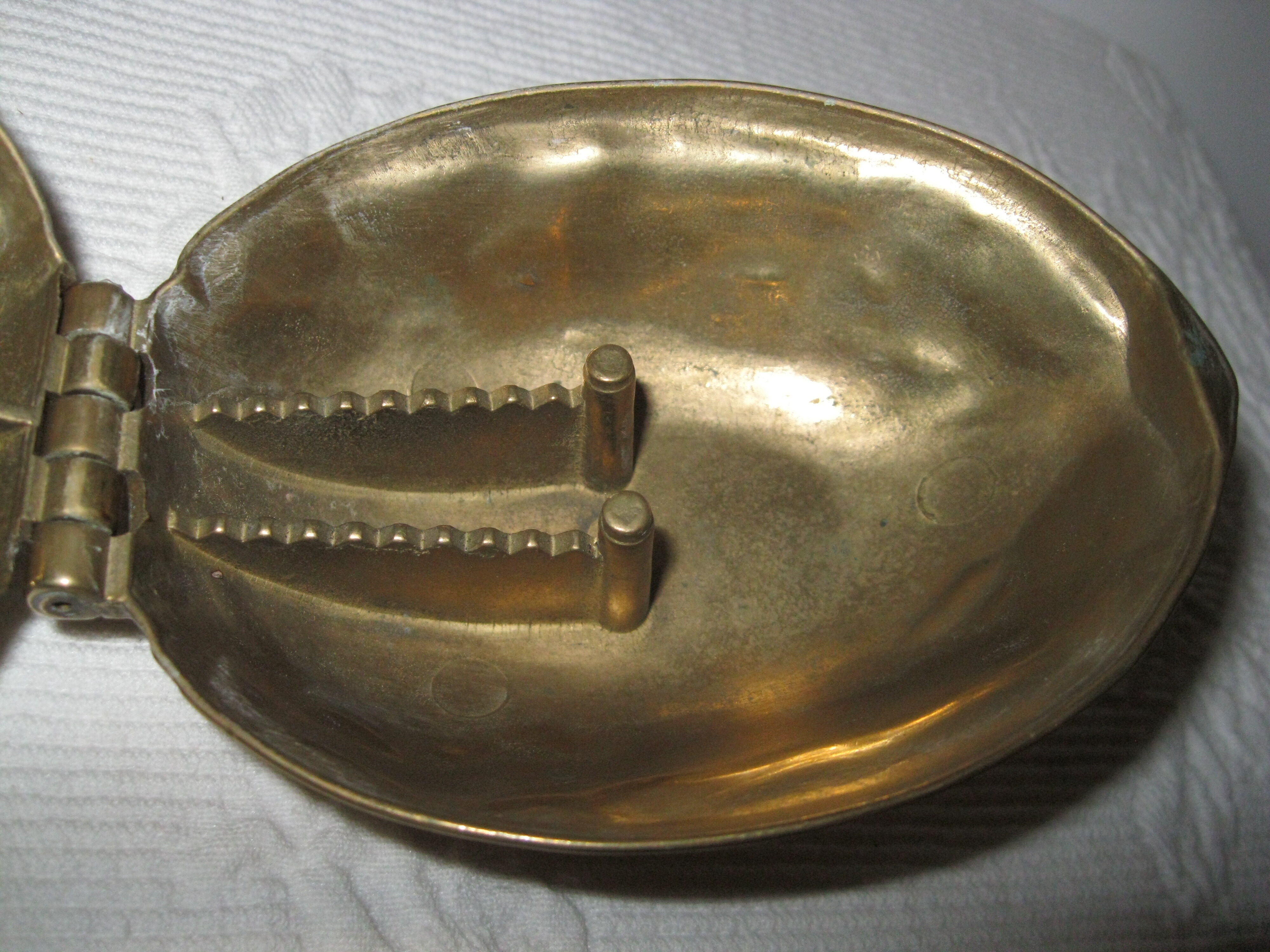 Nut-shaped brass nutcracker
