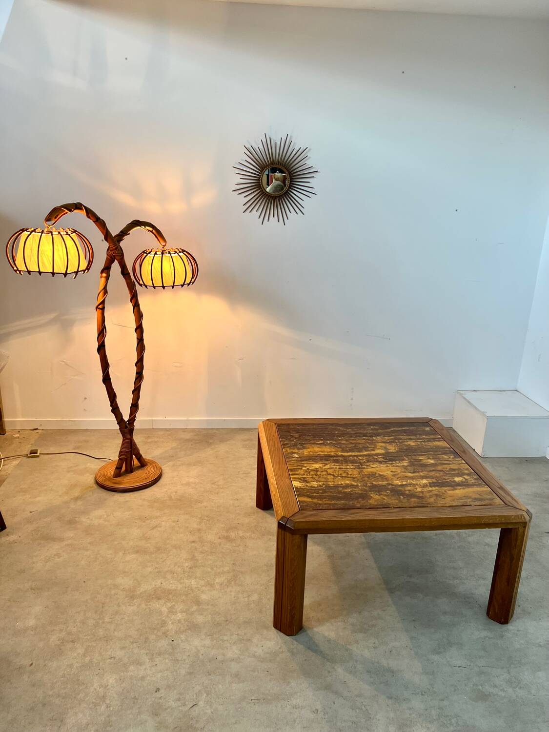 Old coffee table with golden marble top, 70s design, vintage wooden feet