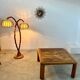 Old coffee table with golden marble top, 70s design, vintage wooden feet