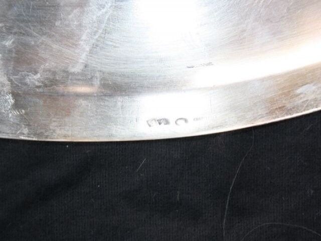 Flat oval silver metal