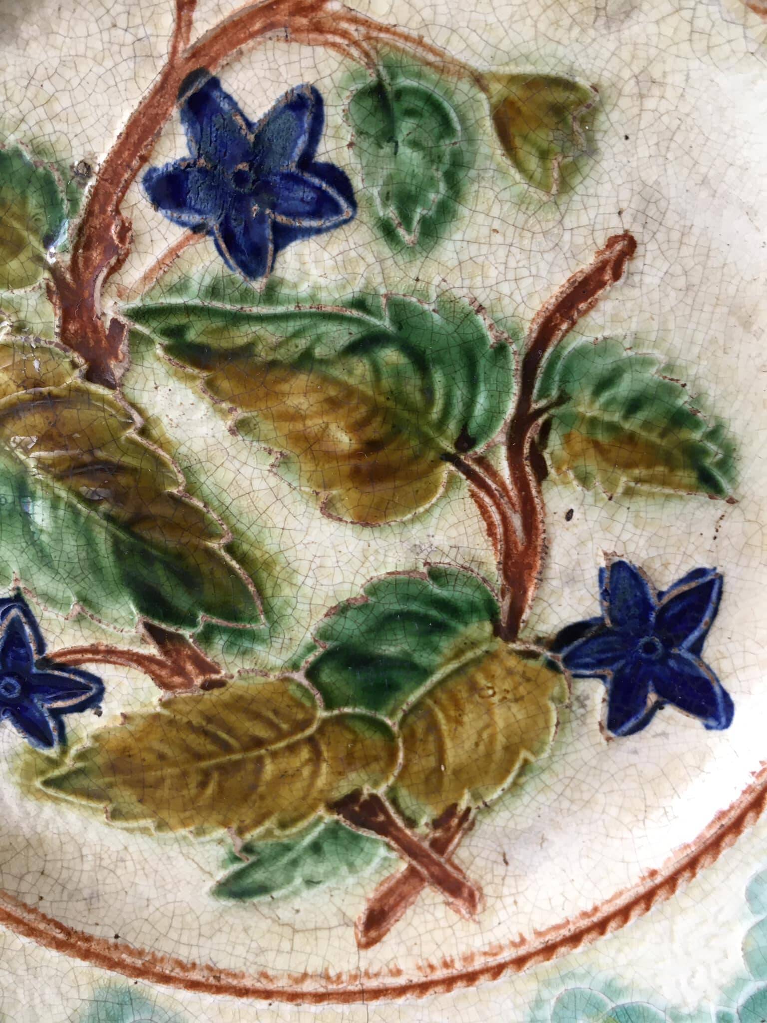 Old barbotine dessert plate. Floral patterns